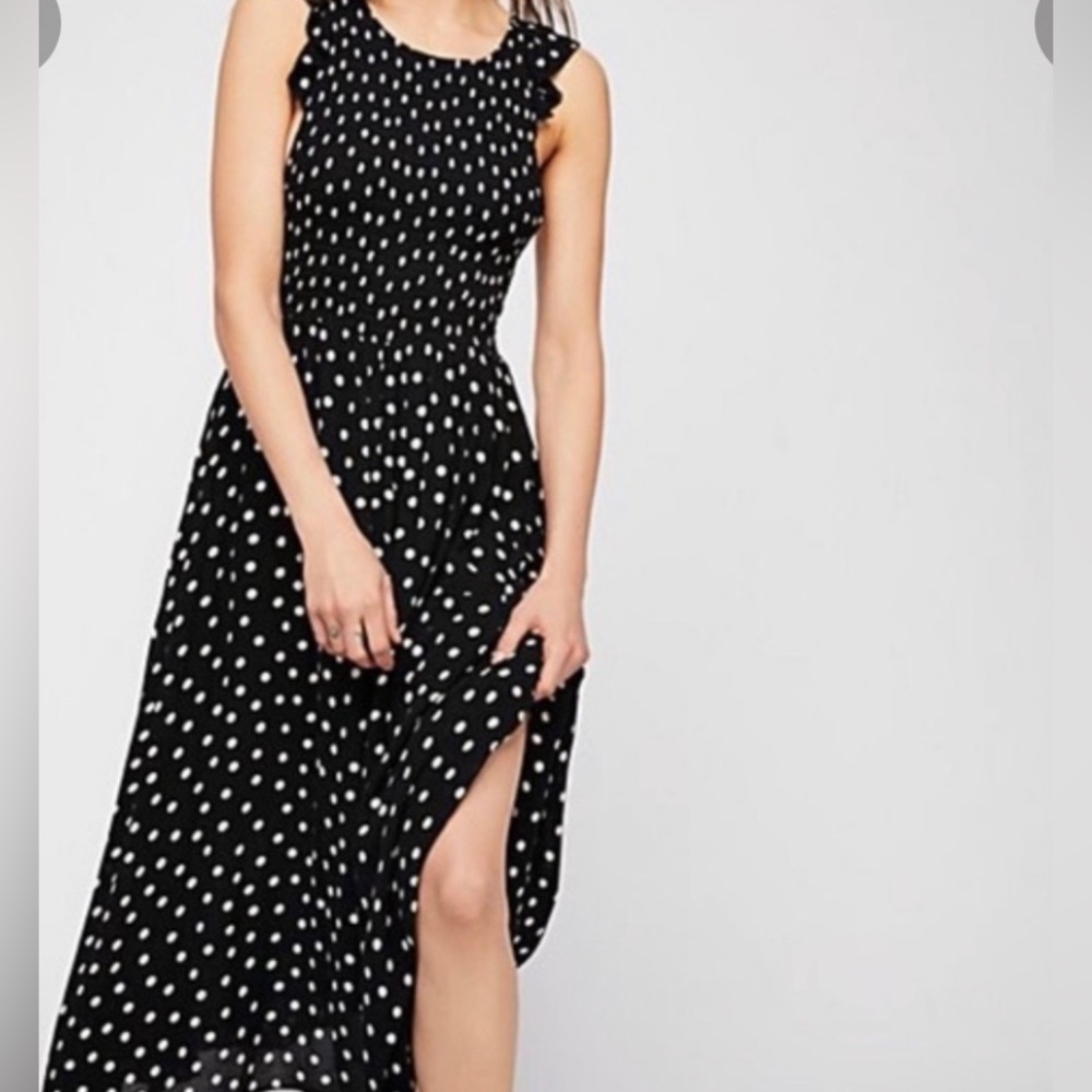 Free People S/P NWOT Black/White polka dot dress. Lined. Semi sheer fabric.